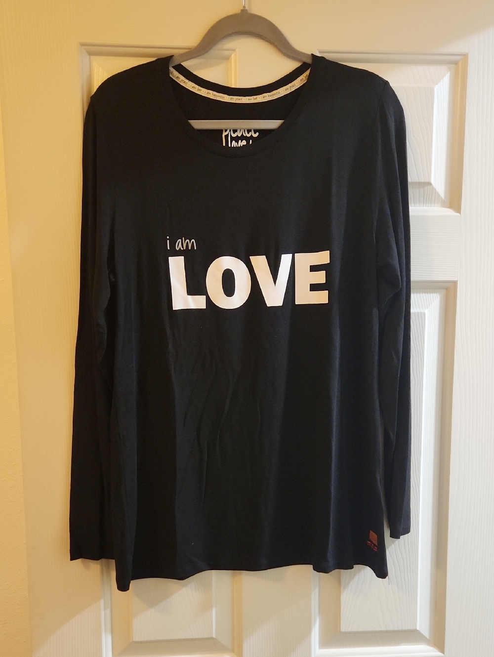 Peace Love World Black Longsleeve Graphic Tee with White Text
